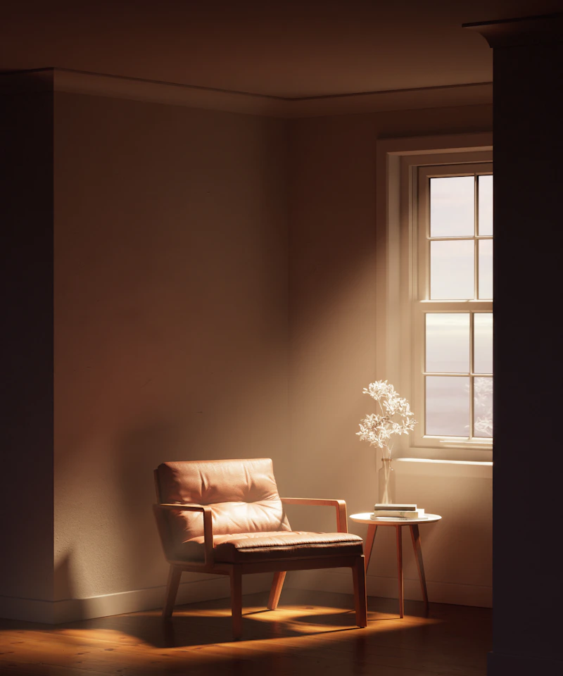 A leather lounge chair in a warmly lit minimalist room